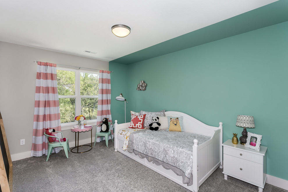 This is an example of a mid-sized arts and crafts kids' bedroom for kids 4-10 years old and girls in Wichita with green walls and carpet.