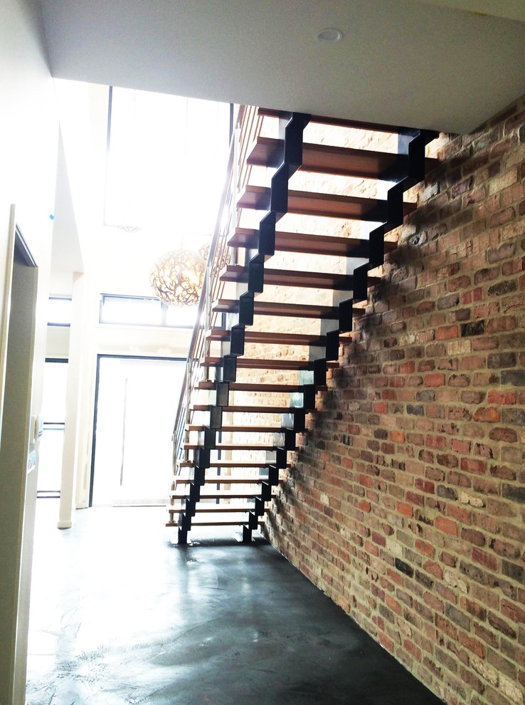 Large industrial wood straight staircase in Brisbane with open risers.