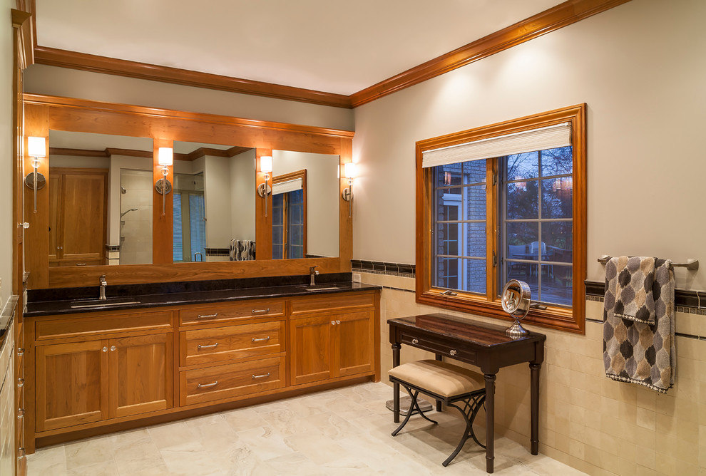 Double shower - large transitional master beige tile and stone tile double shower idea in Cleveland with shaker cabinets, light wood cabinets and quartz countertops