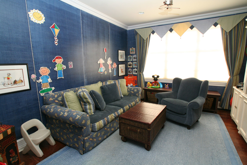 Large transitional kids' room in New York with blue walls and dark hardwood floors for boys.