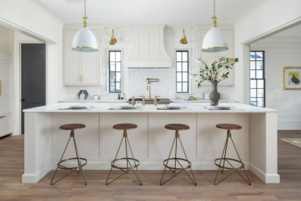 Example of a large transitional l-shaped medium tone wood floor eat-in kitchen design in Charlotte with gray cabinets, marble countertops and an island