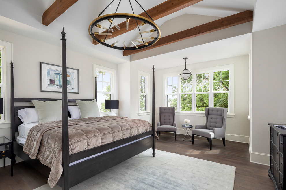 This is an example of a country bedroom in Charlotte with white walls, medium hardwood floors and brown floor.