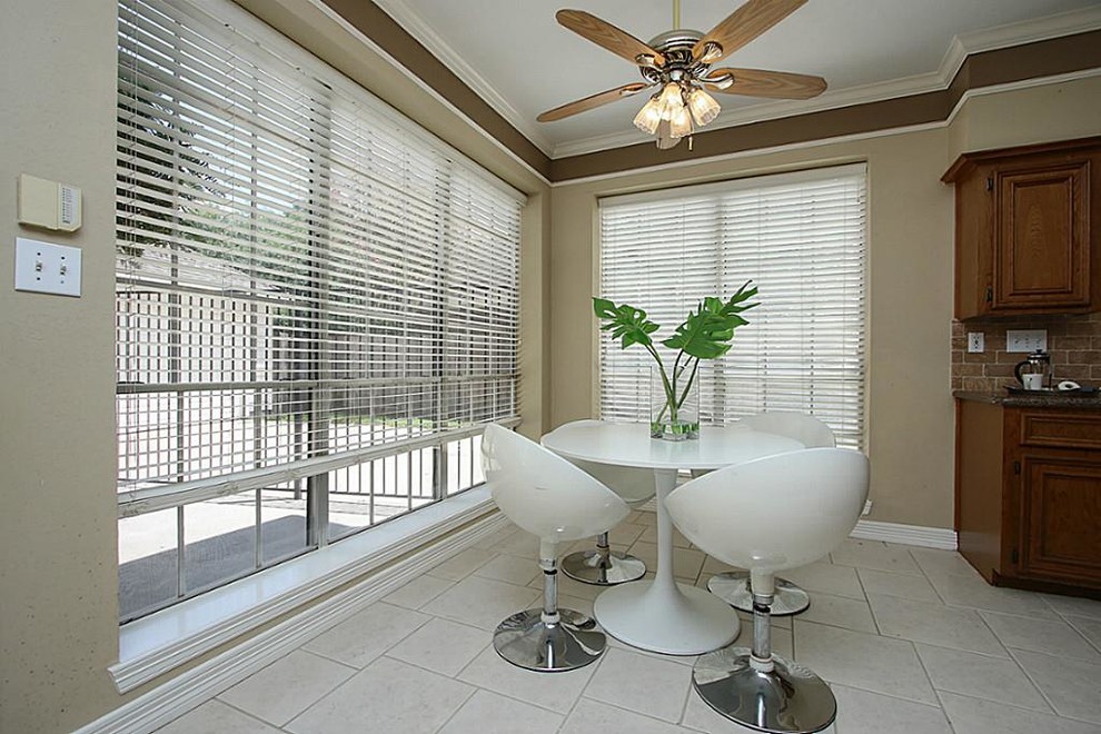 Example of a large transitional u-shaped ceramic tile and beige floor eat-in kitchen design in Houston with beaded inset cabinets, dark wood cabinets, granite countertops, brown backsplash, stone slab backsplash, stainless steel appliances and an island