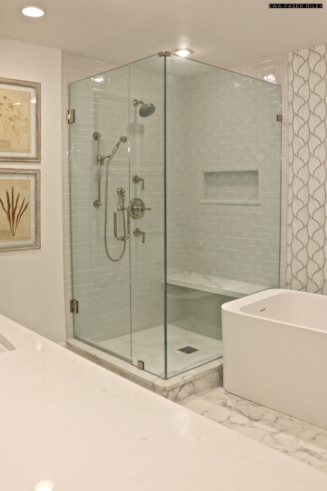 Design ideas for a mid-sized modern master bathroom in Chicago with beaded inset cabinets, grey cabinets, a freestanding tub, a corner shower, a one-piece toilet, gray tile, marble, white walls, marble floors, an undermount sink, marble benchtops, white floor, a hinged shower door and white benchtops.
