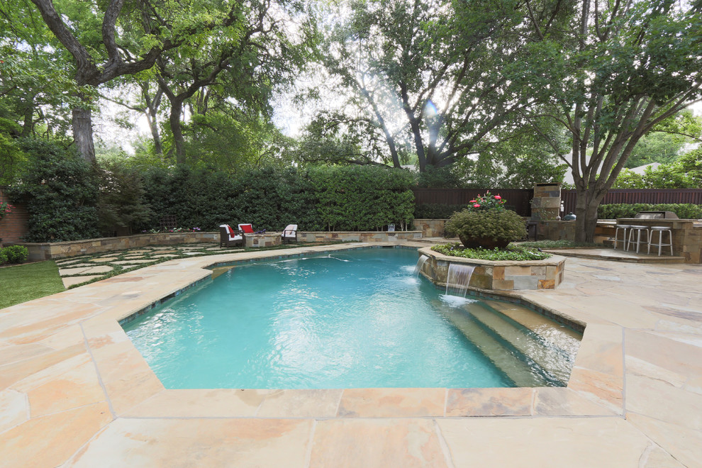 Inspiration for a large transitional backyard stone and custom-shaped water slide remodel