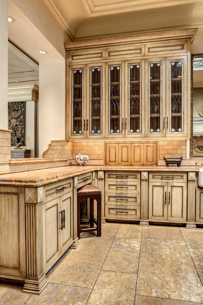 Example of a large brown floor kitchen design with beaded inset cabinets, beige cabinets, brown backsplash, subway tile backsplash and a peninsula