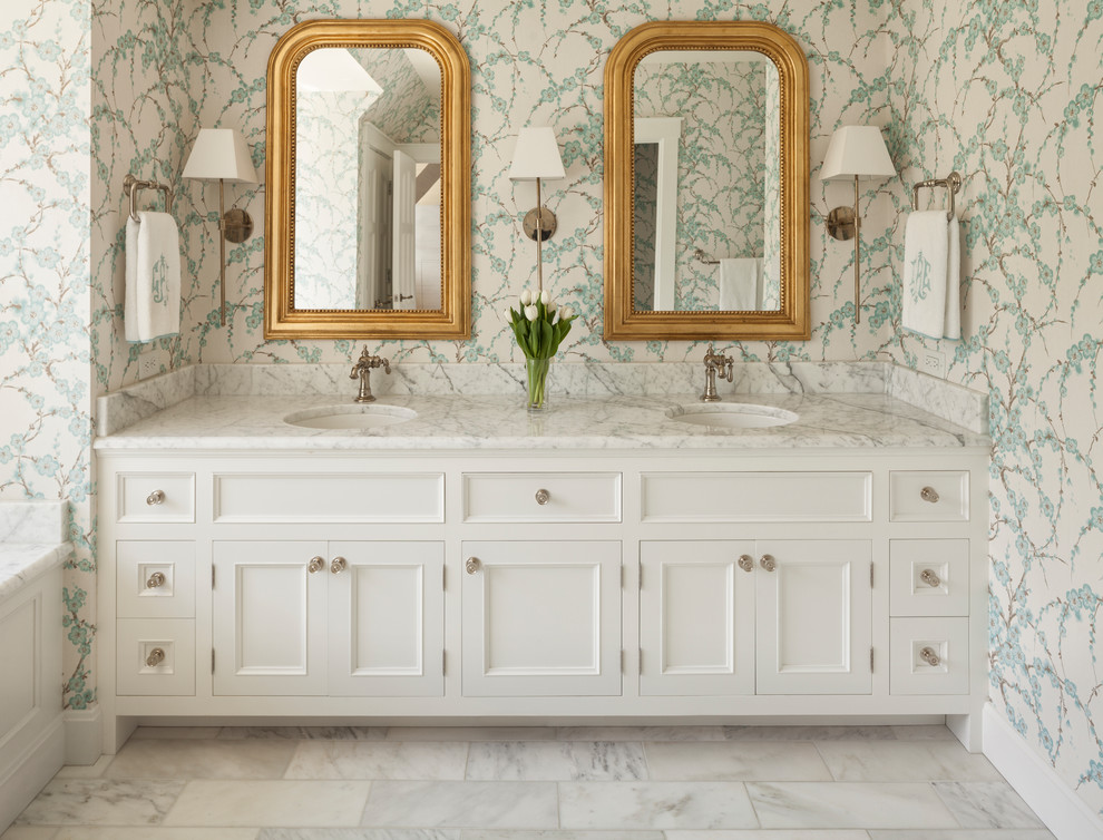 Photo of a traditional master bathroom in Cincinnati with recessed-panel cabinets, white cabinets, multi-coloured walls, marble floors, an undermount sink and white floor.