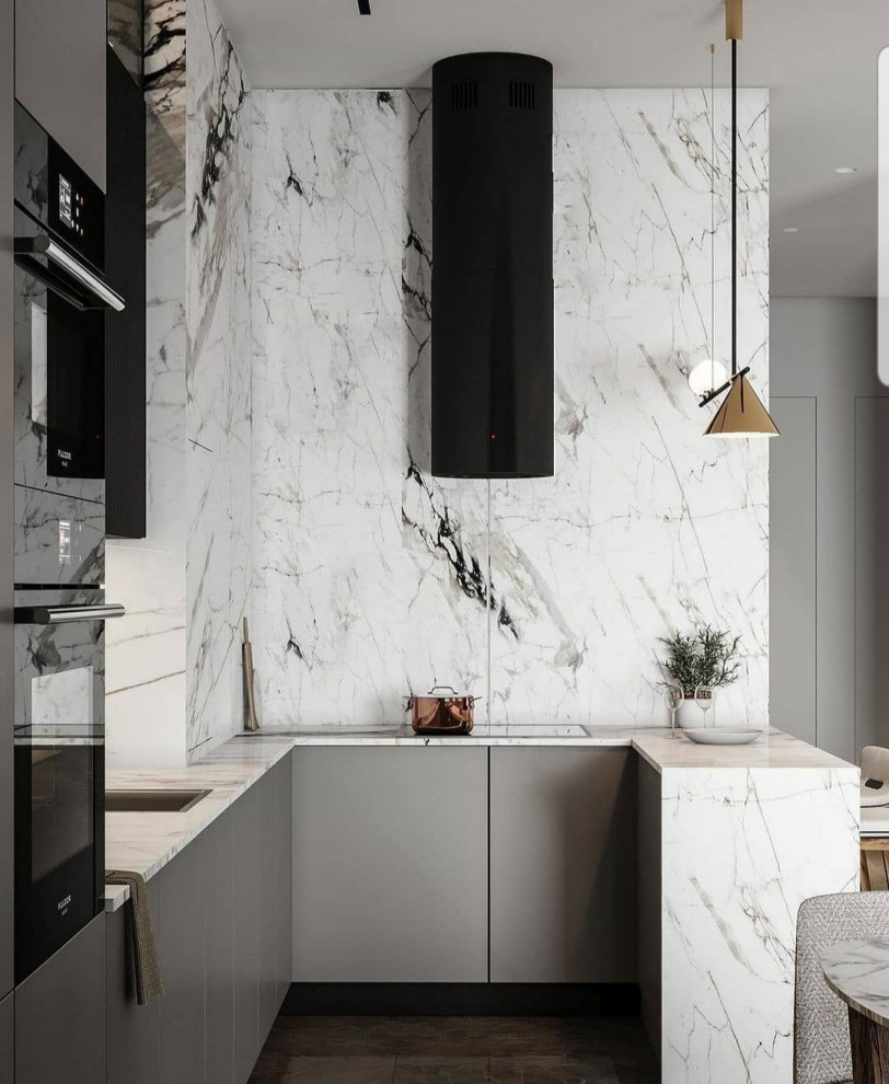 Mid-sized trendy u-shaped light wood floor, yellow floor and tray ceiling eat-in kitchen photo with a drop-in sink, flat-panel cabinets, gray cabinets, quartzite countertops, white backsplash, quartz backsplash, black appliances, a peninsula and white countertops