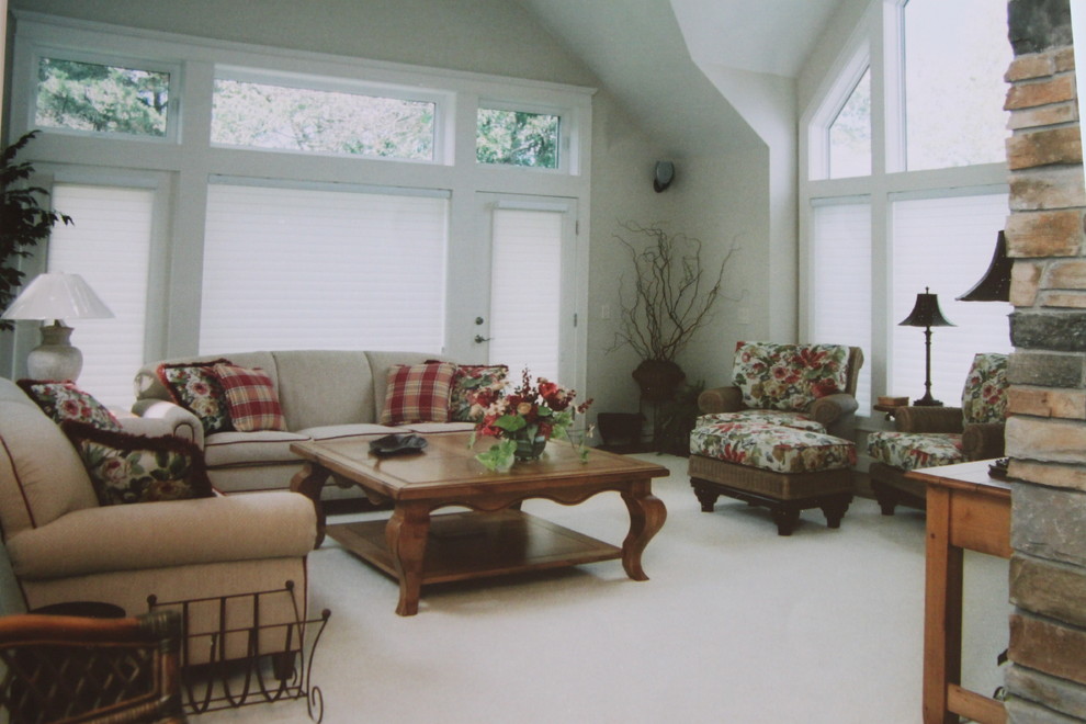 Photo of a large traditional enclosed family room in Minneapolis with white walls, carpet, no fireplace and no tv.
