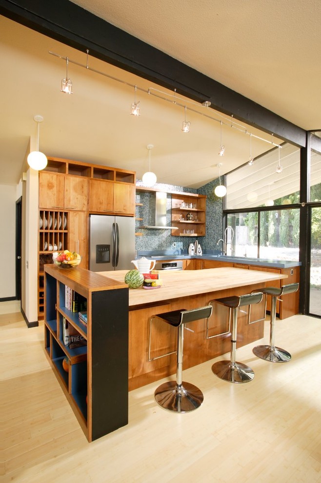 Modern kitchen in Sacramento with wood benchtops, open cabinets, blue splashback, mosaic tile splashback and medium wood cabinets.