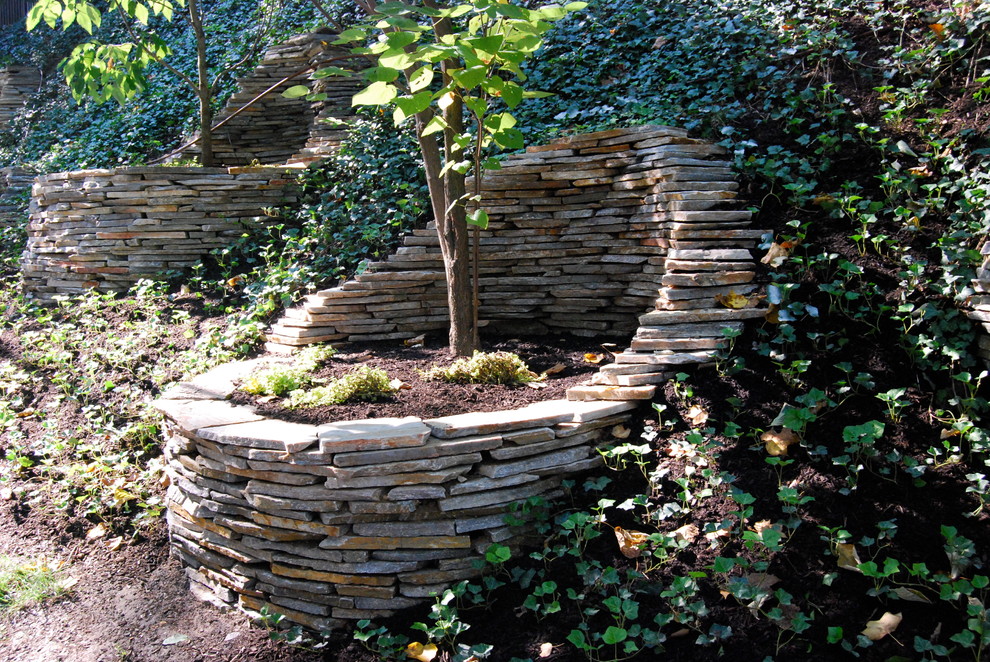 Inspiration for an eclectic garden in Philadelphia with a retaining wall.