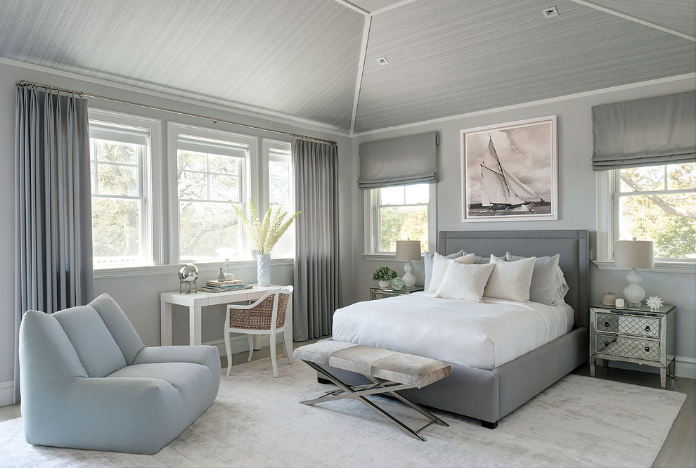 Inspiration for a beach style bedroom in New York with grey walls and grey floor.