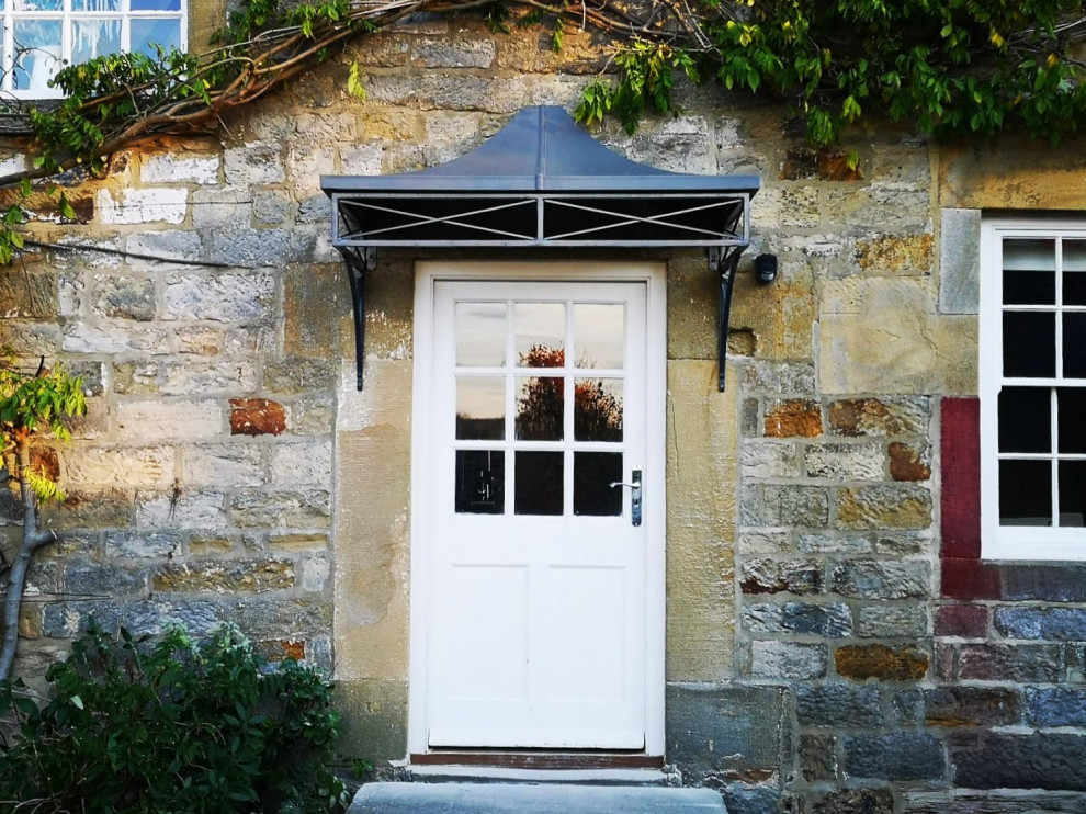 Example of a small classic entryway design in Other with a white front door