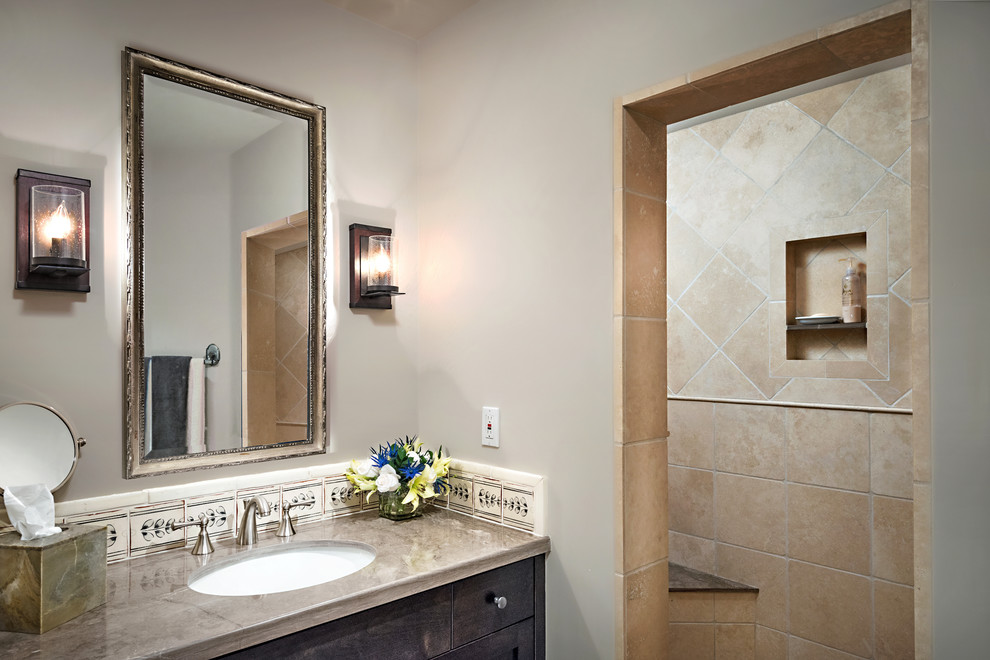 This is an example of a mid-sized transitional bathroom in Phoenix with an undermount sink, shaker cabinets, brown cabinets, marble benchtops, an open shower, a one-piece toilet, black and white tile, terra-cotta tile, travertine floors, white walls and an open shower.