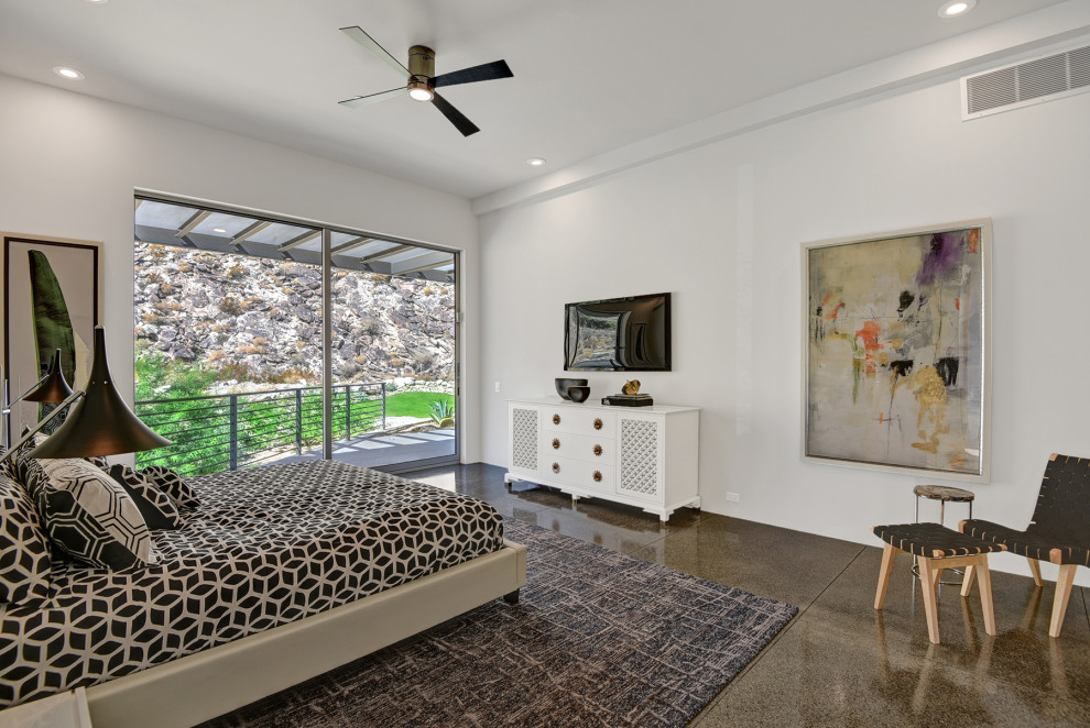 Foto de dormitorio contemporáneo con paredes blancas, suelo de cemento y suelo gris