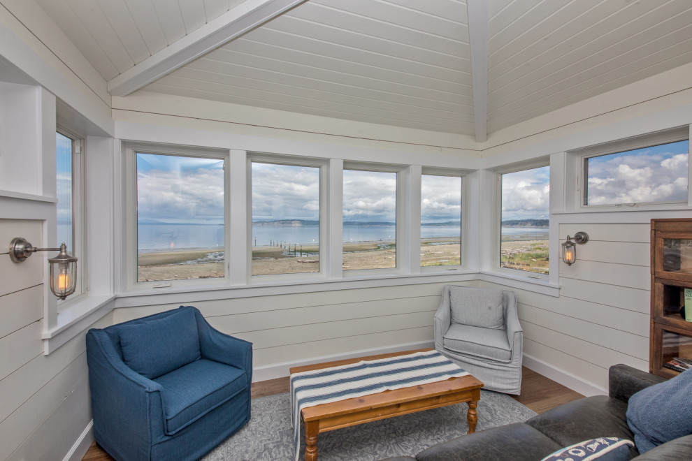 Photo of a beach style sunroom in Seattle.