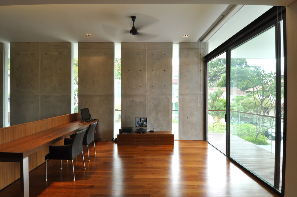 Design ideas for a contemporary home office in Singapore with a built-in desk.