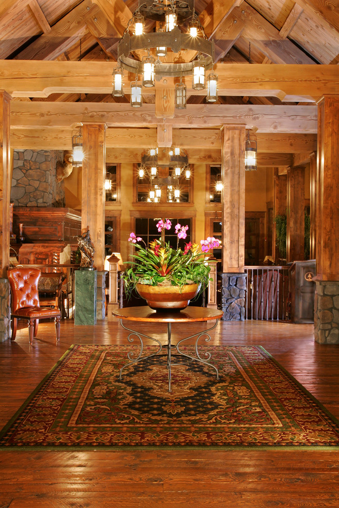 Mountain style medium tone wood floor foyer photo in Seattle