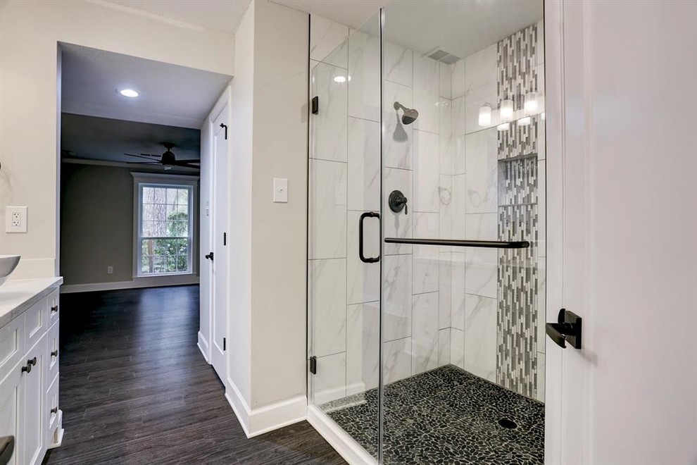 Mid-sized contemporary bathroom in Houston with shaker cabinets, white cabinets, porcelain floors and brown floor.
