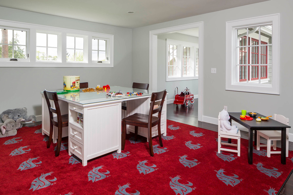 Inspiration for a mid-sized beach style gender-neutral kids' playroom for kids 4-10 years old in Seattle with grey walls, dark hardwood floors and red floor.