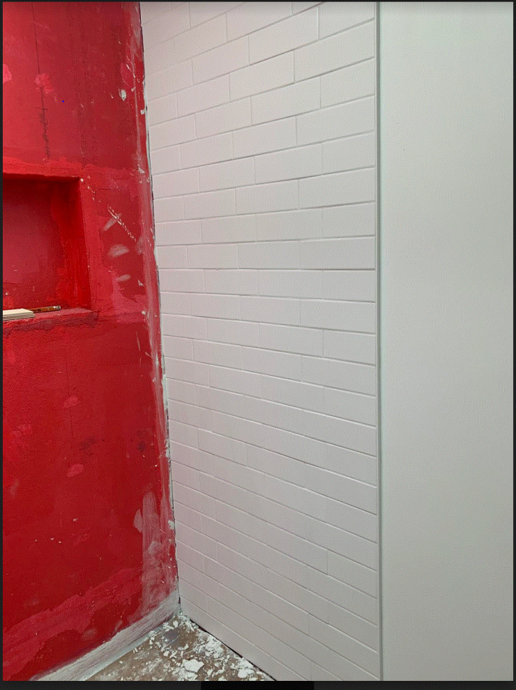 Subway tiles in new bathroom shower have lippage now what?