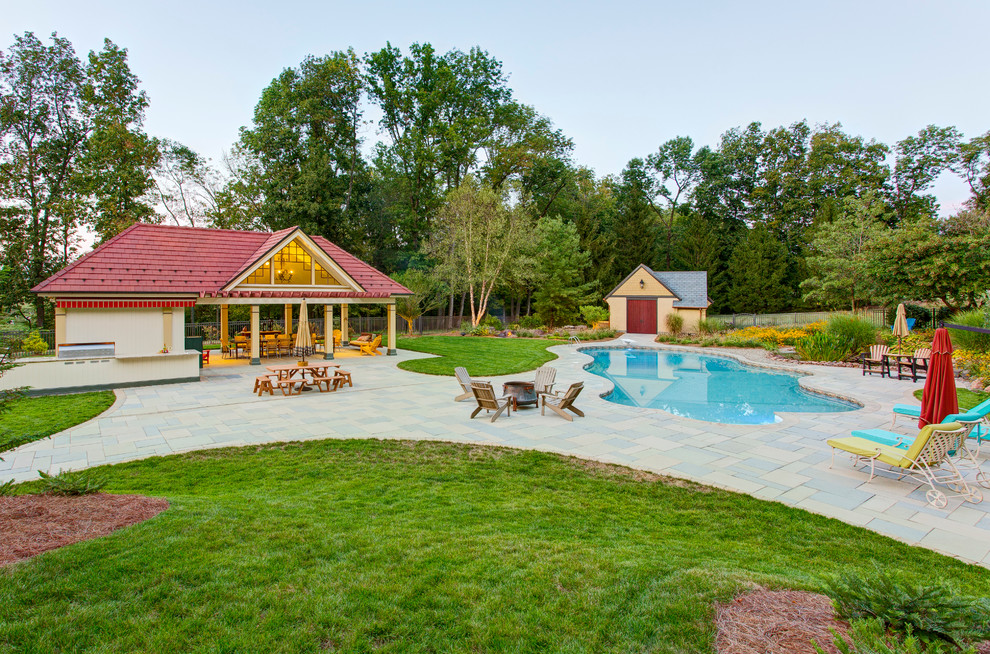 Mid-sized transitional backyard tile and kidney-shaped pool house photo