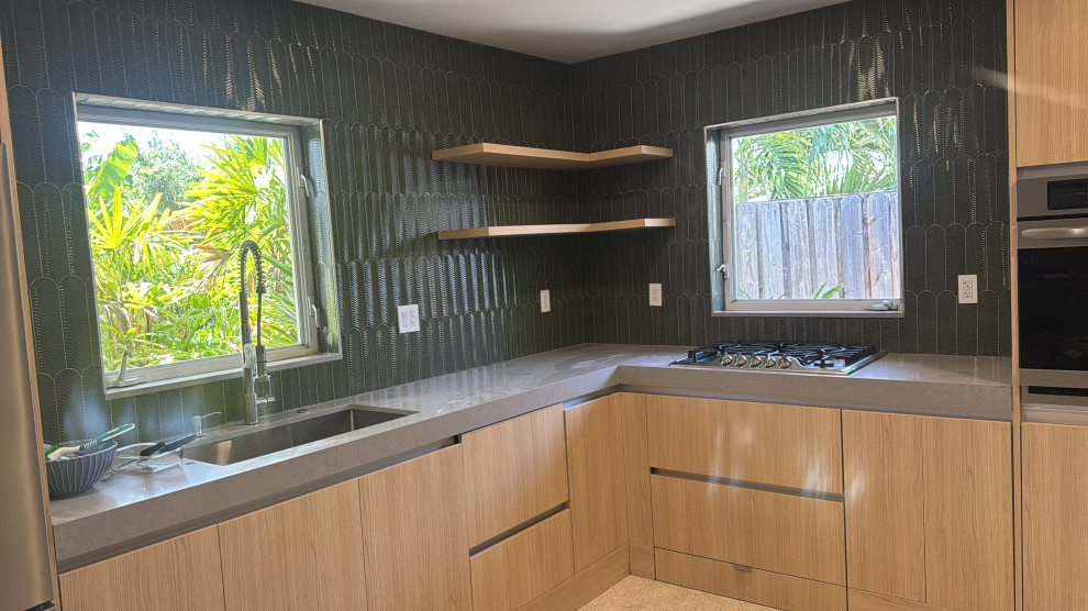 Inspiration for a mid-sized modern kitchen remodel in Miami with green backsplash and ceramic backsplash