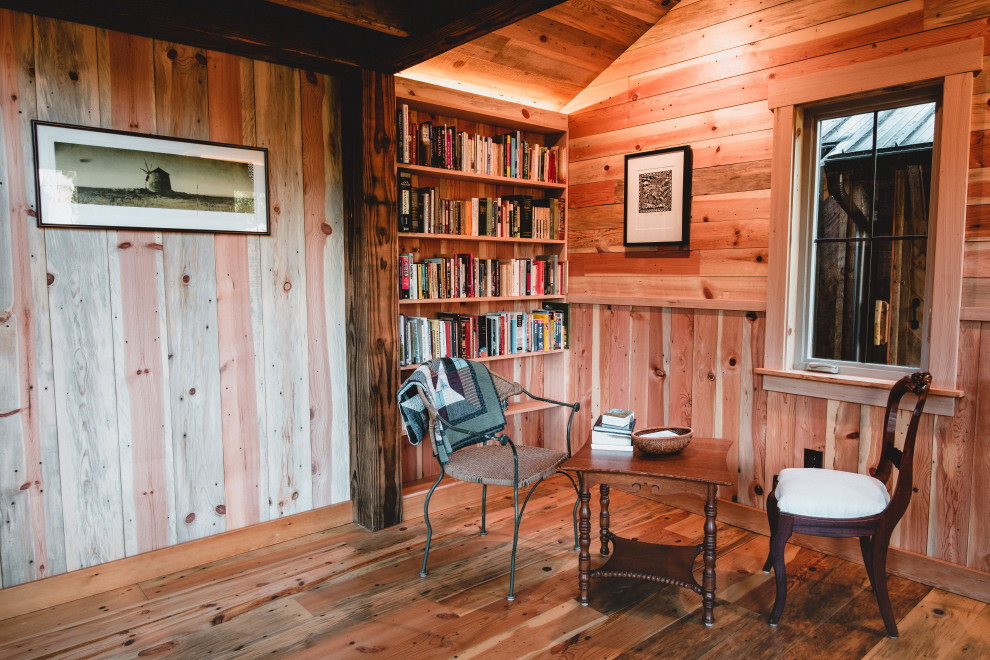 Small country home studio in Seattle with multi-coloured walls, medium hardwood floors, a freestanding desk, multi-coloured floor, timber and decorative wall panelling.