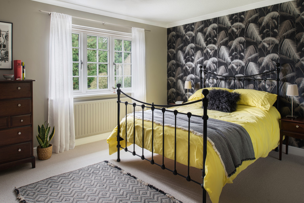 This is an example of a mid-sized contemporary guest bedroom in Hertfordshire with grey walls and carpet.