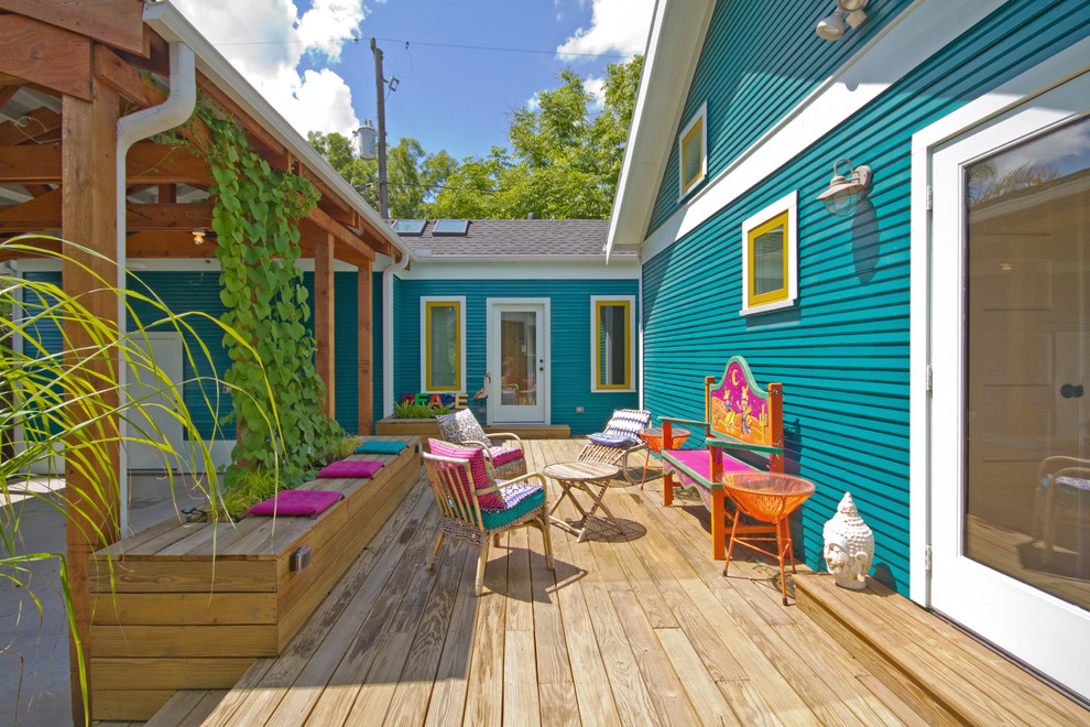 Design ideas for a mid-sized arts and crafts backyard deck in Houston with a container garden and no cover.