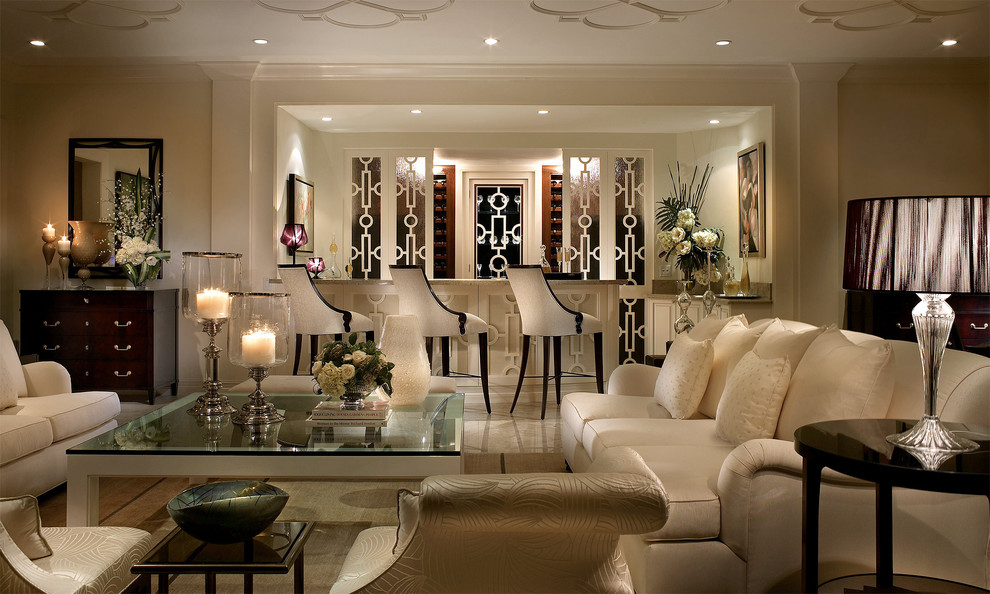 This is an example of a traditional living room in Miami with a home bar and marble floors.