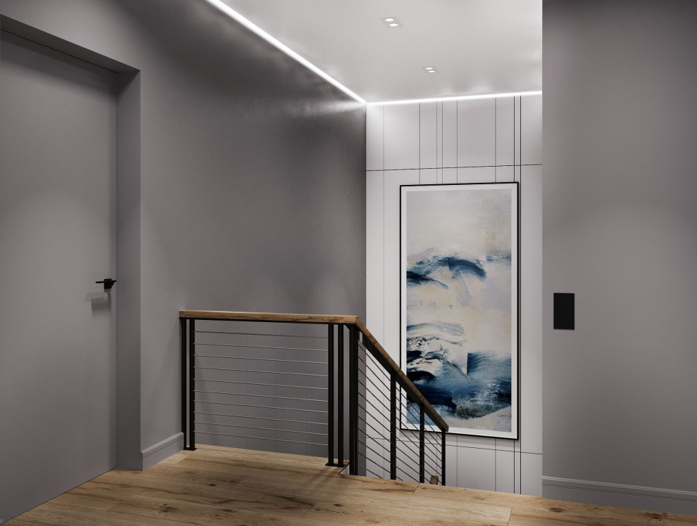 Foto de escalera en U contemporánea de tamaño medio con escalones de madera, contrahuellas de madera, barandilla de madera y papel pintado