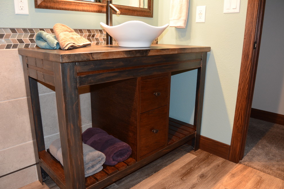 Bathroom - small transitional 3/4 beige tile, brown tile, gray tile and glass tile medium tone wood floor and brown floor bathroom idea with furniture-like cabinets, dark wood cabinets, gray walls, a vessel sink and wood countertops