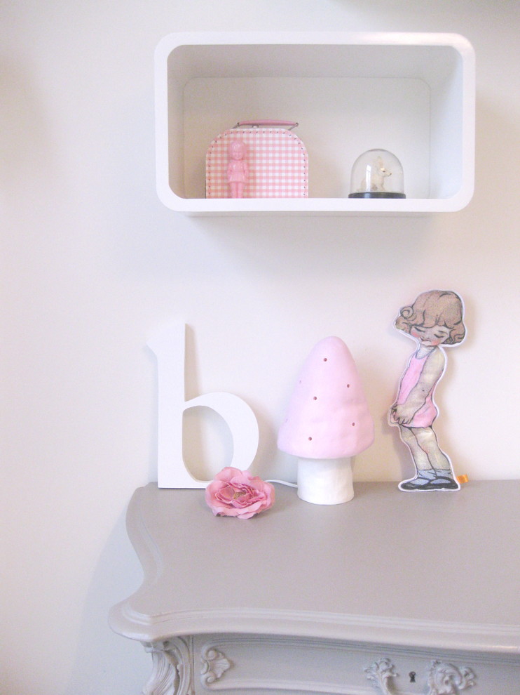 This is an example of an eclectic kids' room for girls in Amsterdam with white walls.