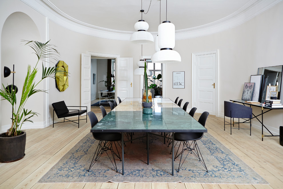 Inspiration for a large transitional separate dining room in Aarhus with white walls, light hardwood floors and beige floor.