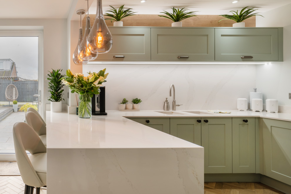 This is an example of a transitional kitchen in Manchester.