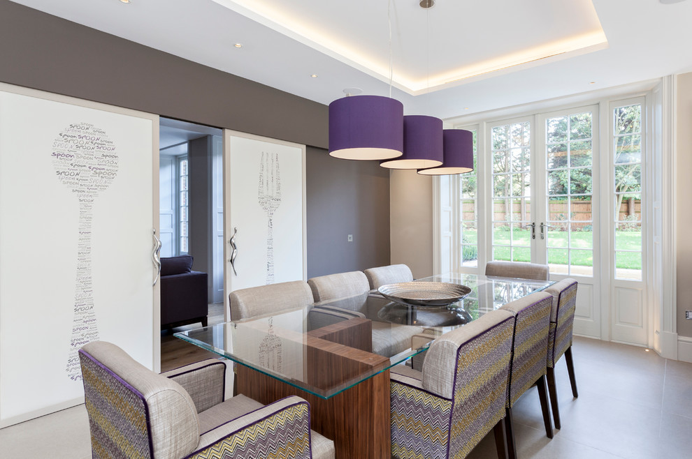Transitional dining room in London with beige walls.
