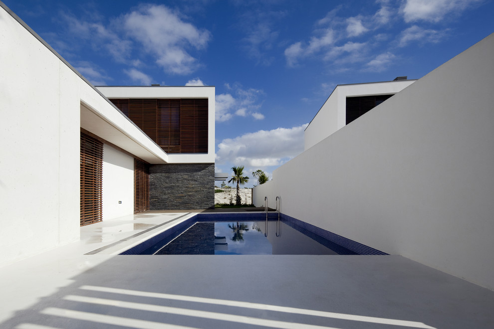 Design ideas for a contemporary courtyard pool in Other.