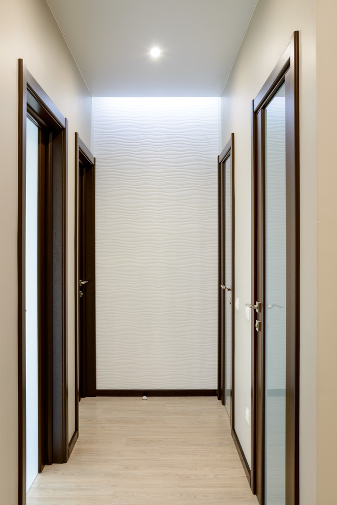 Design ideas for a large contemporary hallway in Novosibirsk with beige walls, vinyl floors and beige floor.