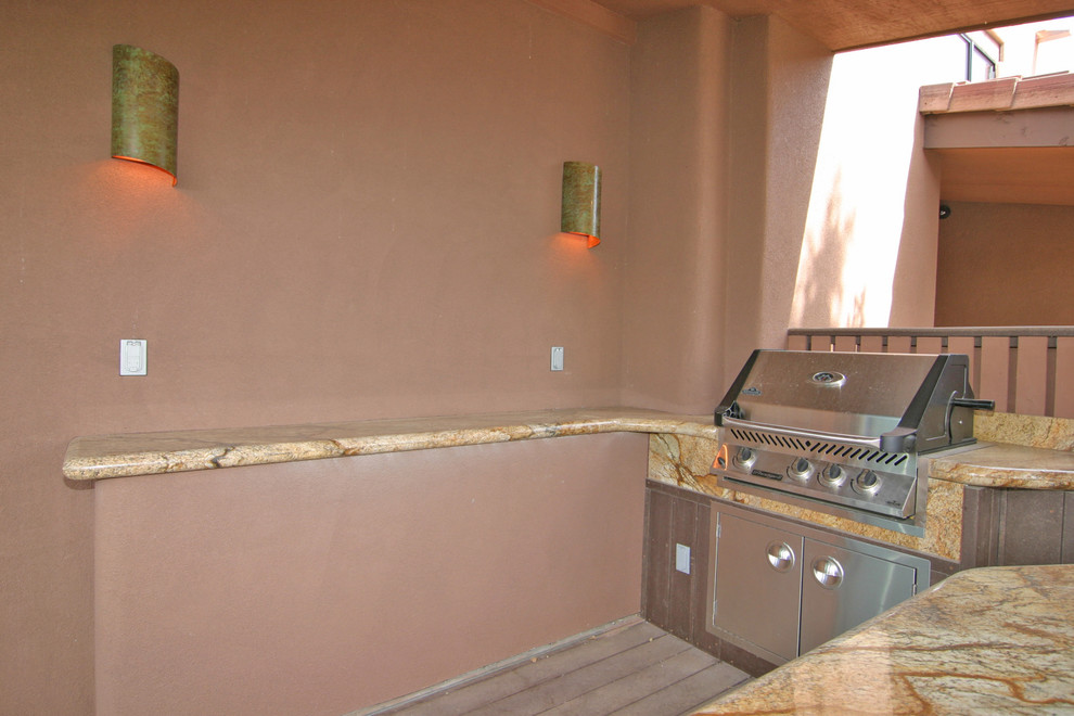 Mid-sized transitional backyard outdoor kitchen deck photo in Phoenix with a roof extension