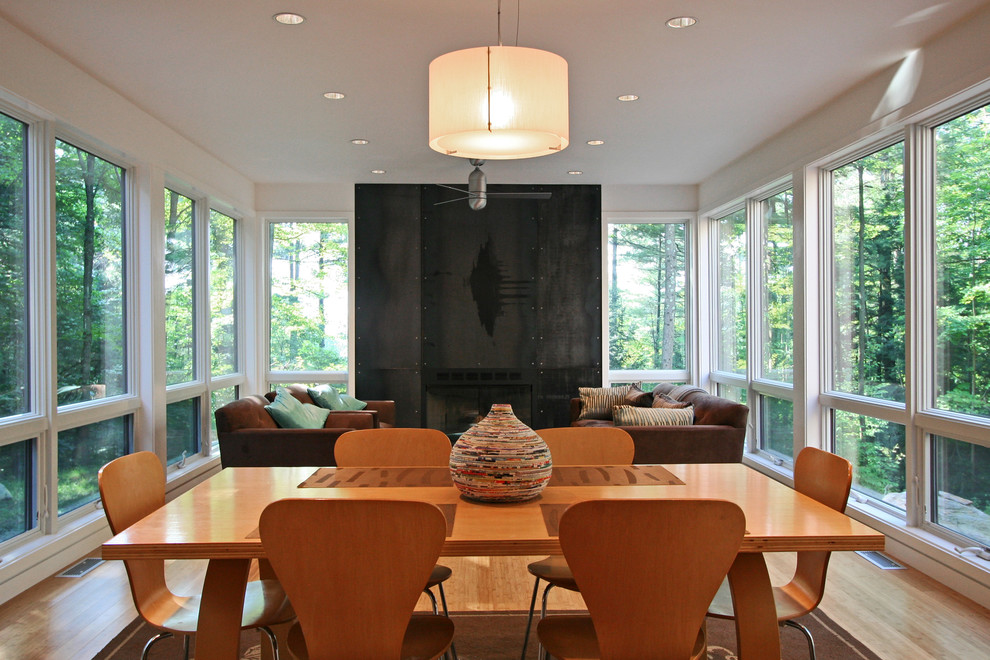 Design ideas for a modern dining room in Boston with white walls.