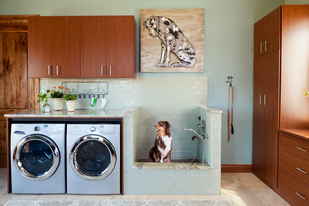 This is an example of a country l-shaped laundry room in Denver with flat-panel cabinets, a side-by-side washer and dryer, beige floor and beige benchtop.