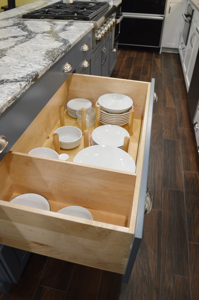 Kitchen - large dark wood floor kitchen idea with shaker cabinets, blue cabinets, quartzite countertops and an island