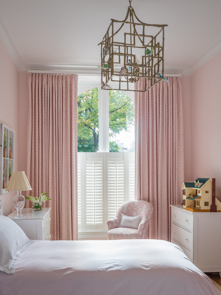 Inspiration for a timeless girl kids' bedroom remodel in Boston with pink walls