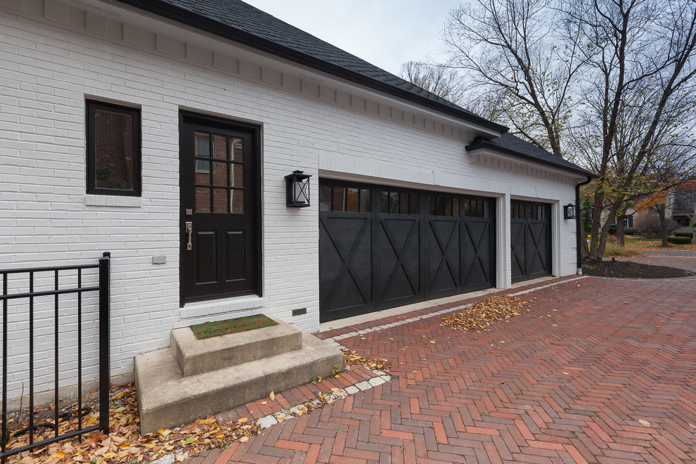 Large transitional two-storey brick white house exterior in Chicago with a shingle roof.