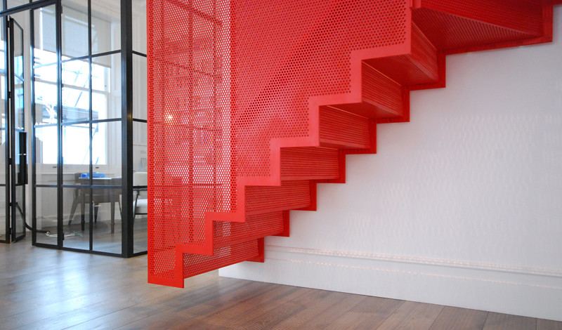 Design ideas for a contemporary metal staircase in London with metal risers.