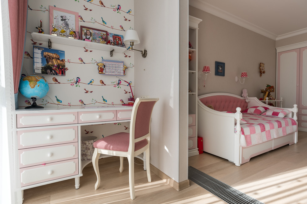 This is an example of a traditional kids' study room for girls in Other with multi-coloured walls and light hardwood floors.