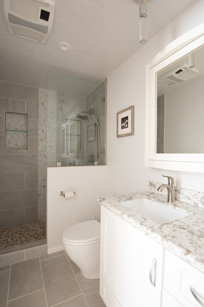 Design ideas for a large modern master bathroom in San Diego with an undermount sink, shaker cabinets, white cabinets, engineered quartz benchtops, an open shower, a one-piece toilet, gray tile, porcelain tile, white walls and porcelain floors.