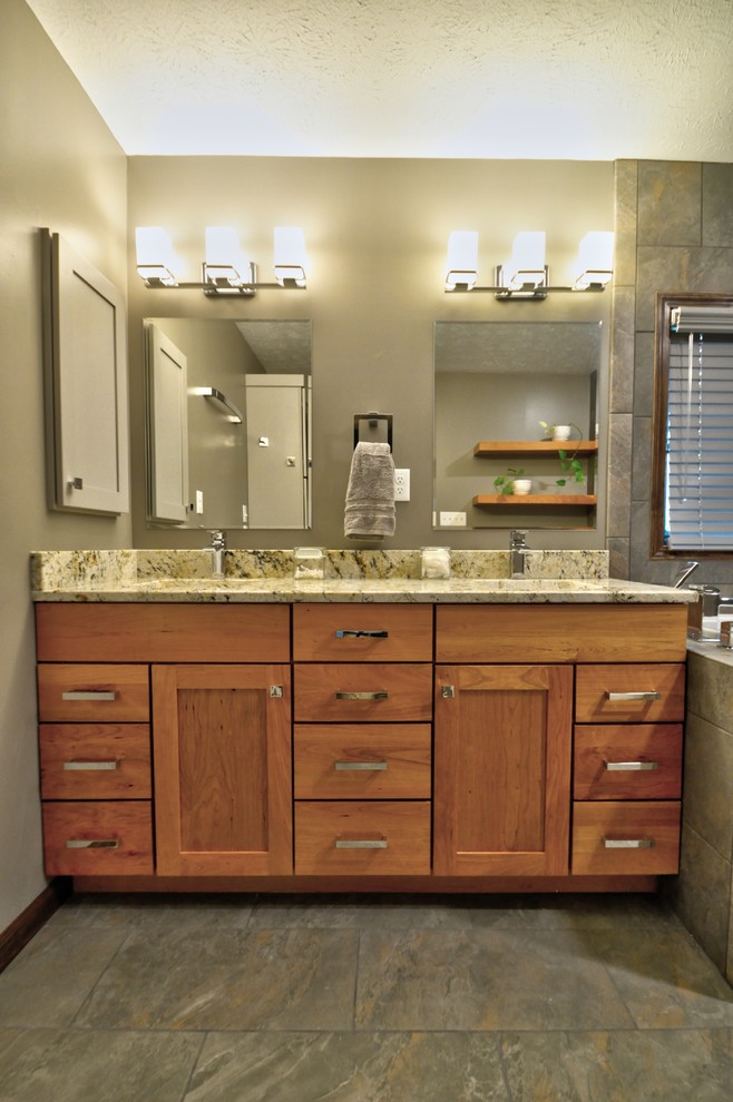 Inspiration for a mid-sized contemporary master bathroom in Other with shaker cabinets, medium wood cabinets, a drop-in tub, an open shower, a two-piece toilet, multi-coloured tile, ceramic tile, beige walls, ceramic floors, an undermount sink, granite benchtops, beige floor, an open shower and beige benchtops.