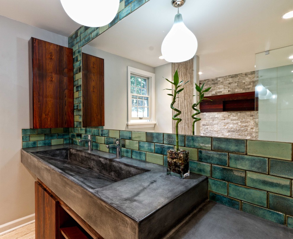Large 1960s 3/4 green tile and cement tile porcelain tile and beige floor bathroom photo in Other with flat-panel cabinets, dark wood cabinets, a two-piece toilet, beige walls, a trough sink and concrete countertops